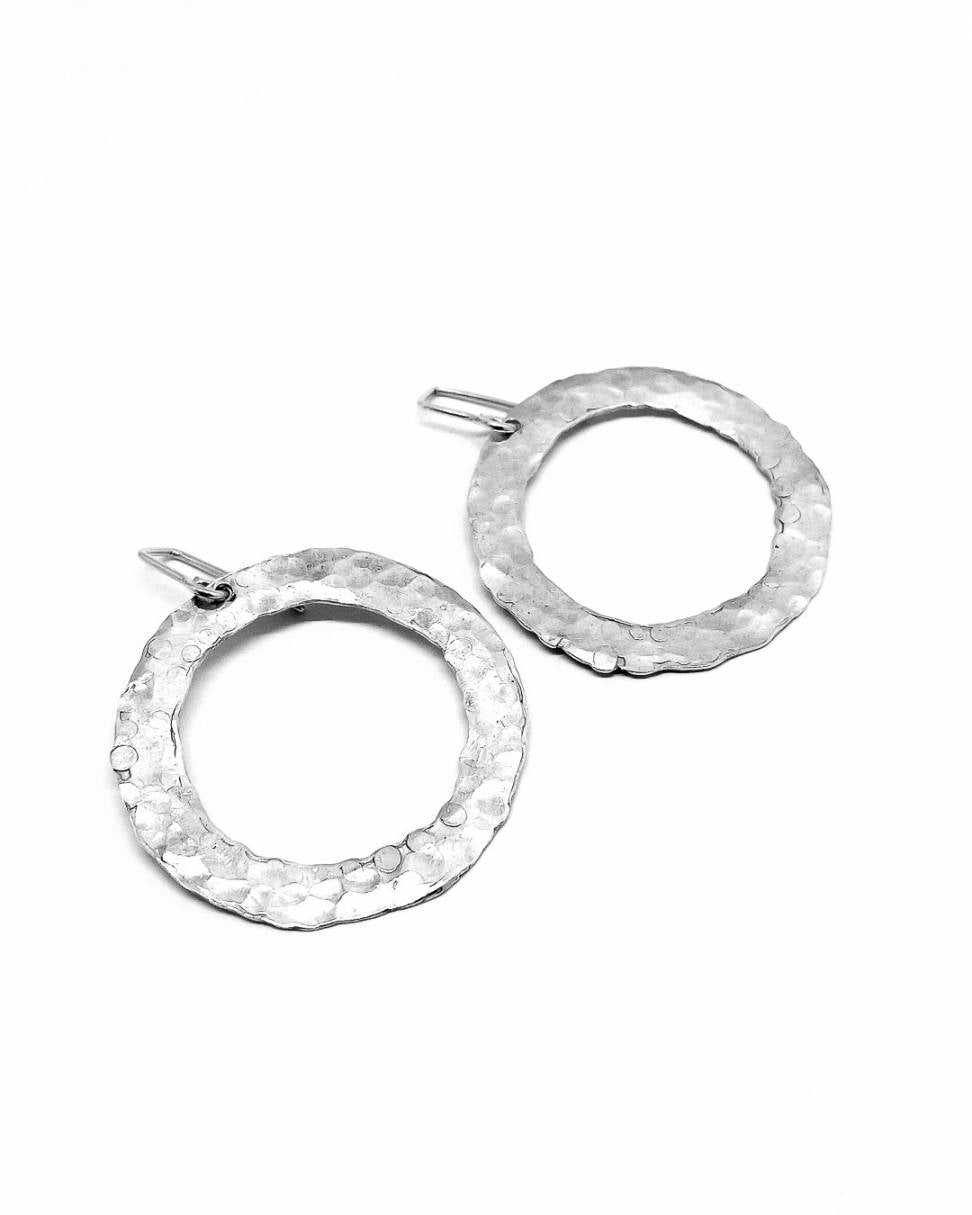 Front view of a pair of Sterling Silver textured Circle Hoop Earrings