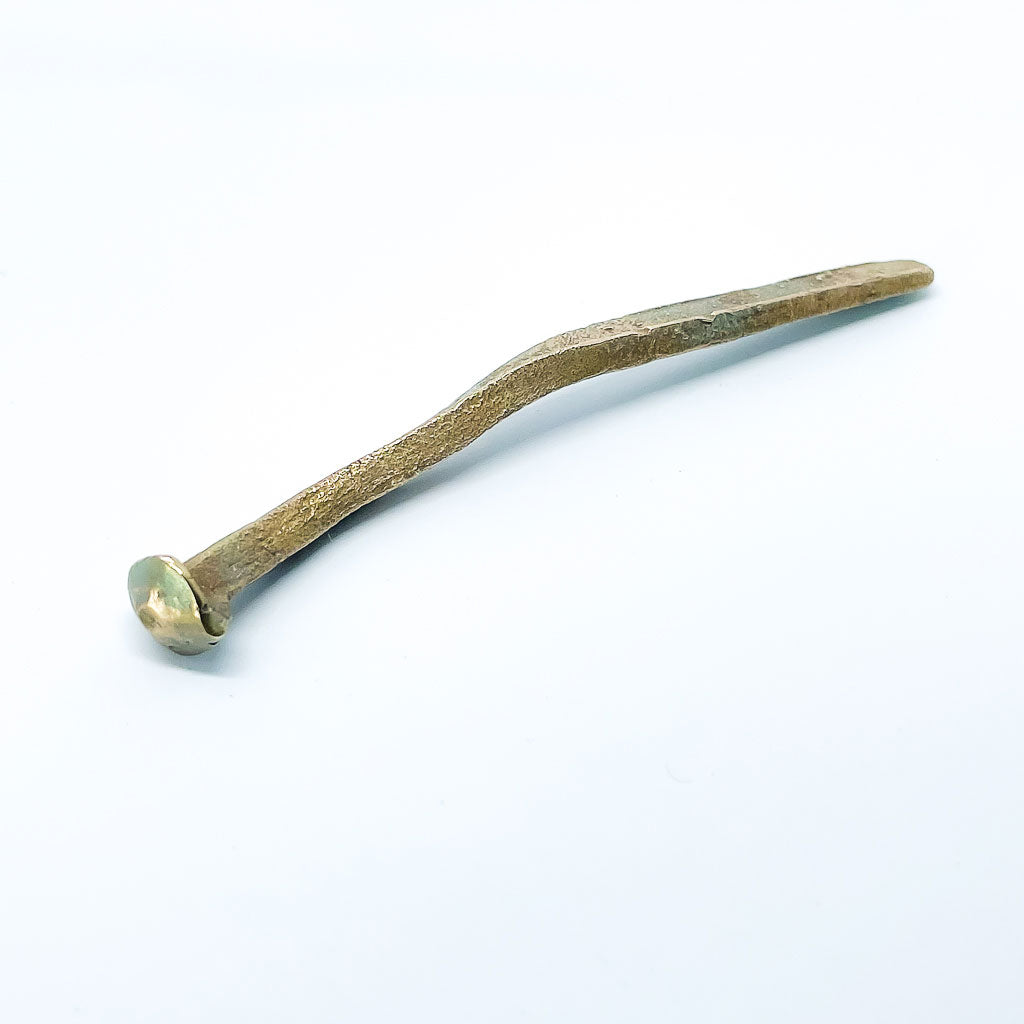 A Bronze casting of a 19th century sheet nail