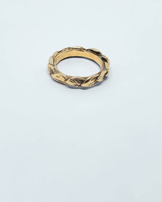A stacking ring formed with overlapping 3d leaves in 9ct solid yellow gold