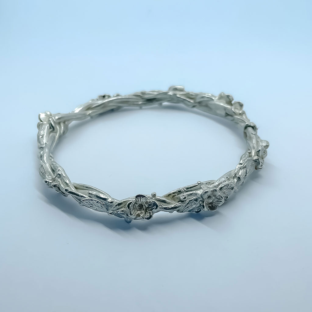 Sterling Silver Bangle formed from wrapped vines, leaves and flowers